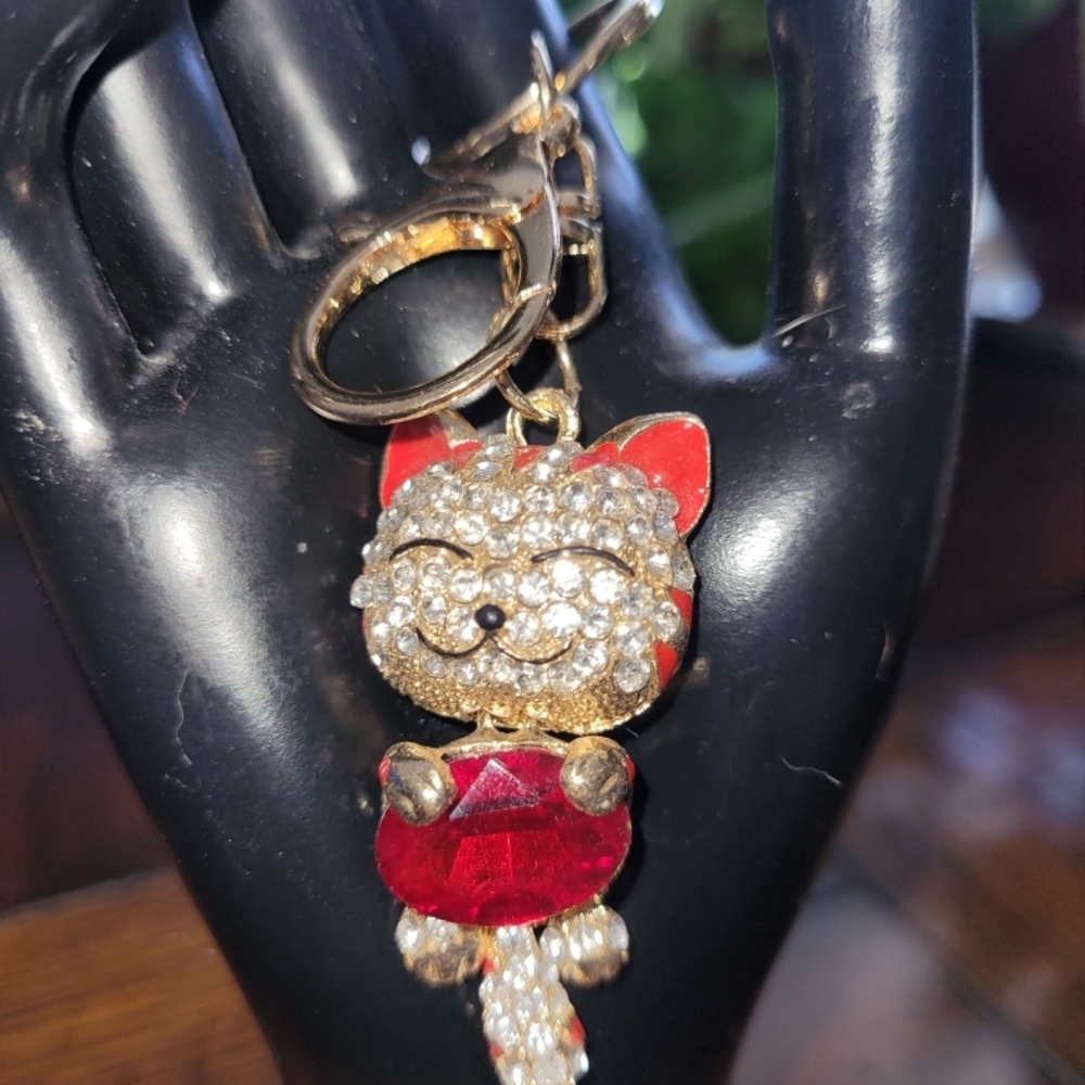 Sparkling Cat Keychain with Red and Gold Accents